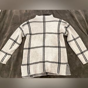 Gray sweater with black plaid stripes. Rarely worn.
